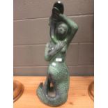A patinated terracotta sculpture of a mermaid, from a fountain, 65cm
