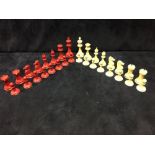 A red and white bone Staunton chess set, the pieces of the classic shape, 8cm (3.25 in) high Good