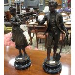 A pair of bronzed spelter figures in the French style (2)