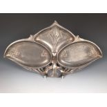 A WMF Art Nouveau pewter hors d'oeuvres dish, with embossed decoration and loop handle, together