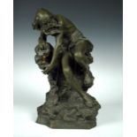 A bronzed spelter figure depicting 'The Miser' signed 'Toretay', circa 1900, the bearded man