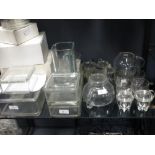A collection of glass items to include a teapot and boxes