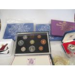 A small collection of loose coins, including pre-decimal coinage sets, silver proof crown and