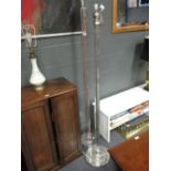 Two similar glass standard lamps, one possibly by Adnet