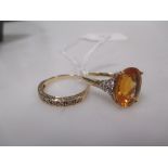 A 9ct golden-yellow citrine and diamond ring, size Q and a 9ct half hoop diamond eternity ring, size