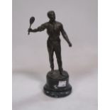 A patinated metal figure of a tennis player, possibly WMF, 24cm high