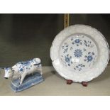 An 18th century English Delft plate together with a later Dutch Delft bull