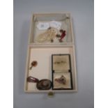 A quantity of jewellery to include an amethyst and seed pearl pendant, a graduated pearl necklace