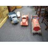 A wooden toy flatbed lorry 'J. Leader Ltd' together with another, a ride on train and a taxi (4)