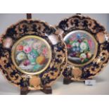 A pair of Davenport mid 19th century porcelain plates painted with still life panel of fruit and