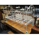 A 19th century wrought iron cot - length 141cm x height 86cm x width 58cm