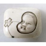 Hoichi', an ivory manju, the rectangular pillow shape carved in relief with a kite in the form of
