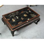 An inlaid black lacquer low table, the red edged rectangular top inlaid with children playing within