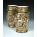 A pair of late 19th/early 20th century Satsuma vases, the rounded hexagonal sides painted with