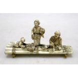 Toshikazu', an early 20th century ivory raft group, the sectional figures of the father seated