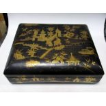 A mid 19th century gilt black lacquer box, containing two other boxes, a Canton enamel bowl and