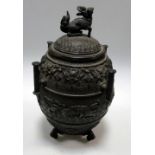 A late 19th/early 20th century bronze vase and cover, the latter with kirin finial, four baton