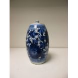 An 18th century blue and white barrel shaped bottle, the flat top painted with scrolls enclosing a