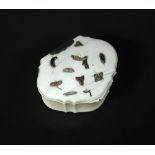 A Shibayama snuff box together with three smaller ivory pieces, the hinged shell shaped lid inlaid