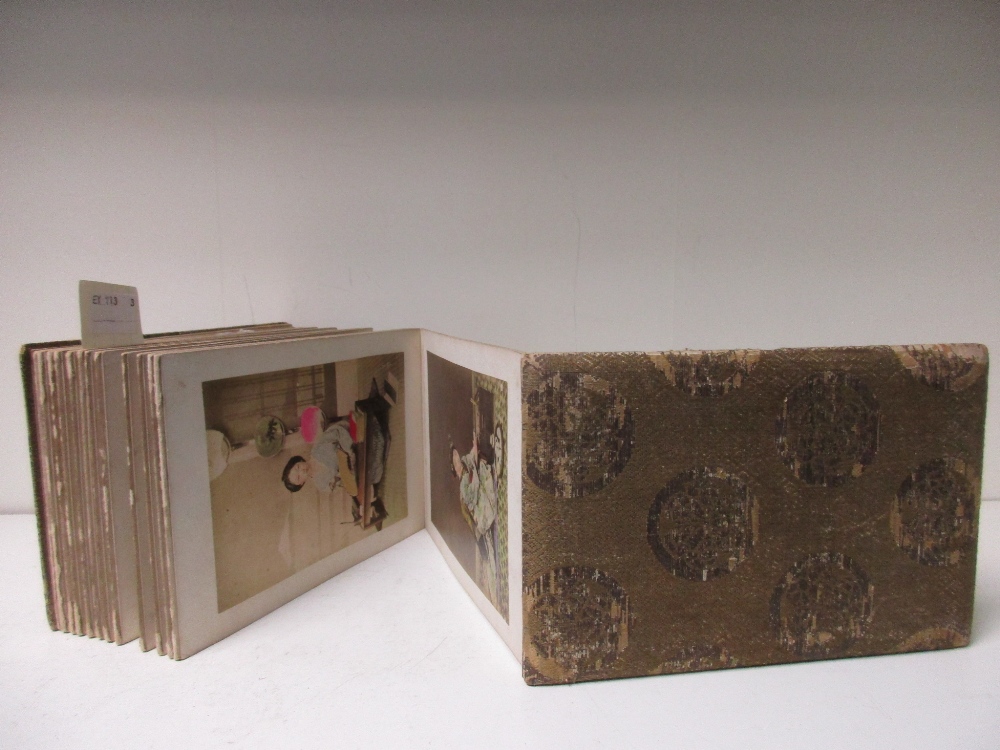 A late 19th/early 20th century concertina album of fifty one tinted photographs, depicting figures