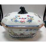 An 18th century soup tureen and cover, the sides painted with a lady in a boat approaching a man