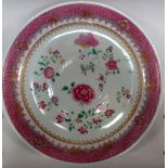 A late 18th/early 19th century famille rose dish painted with scattered flowers within a pink