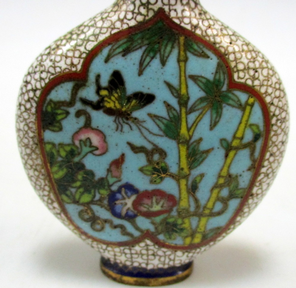 A cloisonne snuff bottle and stopper worked with two turquoise ground reserves of gardens on a white - Image 2 of 6