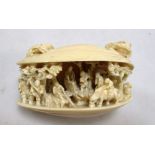 A late 19th/early 20th century ivory clam's dream, the top of the open shell carved with a toad