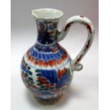 A 'Clobbered' 18th century blue and white ewer, the handle to one side of the baluster shape later