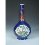 A late 19th/early 20th century powder blue ground bottle vase painted in famille verte enamels