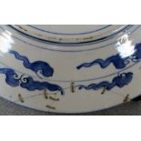 An early 20th century Imari dish another smaller and a collection of five plates, the rim of the