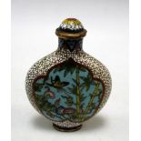A cloisonne snuff bottle and stopper worked with two turquoise ground reserves of gardens on a white