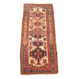 A West Persian short runner, 268 x 99cm (105 x 39in)