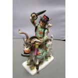 A Meissen model of Count Bruhl's tailor holding his scissors aloft as he rides a goat with a clothes