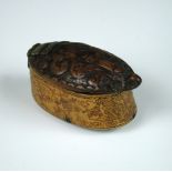 A late 17th/early 18th century horn and carved wood snuff box, the oval silver hinged lid carved