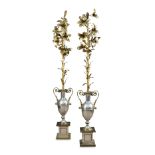 Possibly Maison Charles, a pair of silvered and gilt metal floor lamps, the gilt foliate stems to