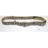 A 19th century Russian lady's belt, formed from thirty-four rectangular, embossed and niello