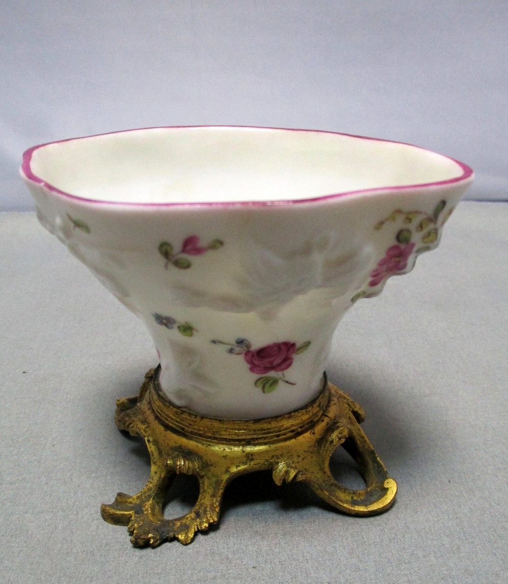A Meissen sweetmeat bowl in the form of a blanc de Chine libation cup with flower painted moulded