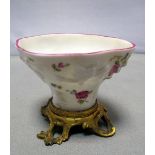 A Meissen sweetmeat bowl in the form of a blanc de Chine libation cup with flower painted moulded