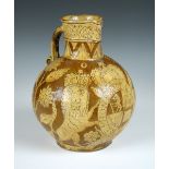 A dated Barnstaple slip decorated ewer, the yellow slip sgrafitto decorated through to the brown