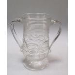 A mid 18th century two handled mug, the slender thistle shape supported on flared circular foot, the