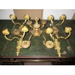 Four gilt bronze two branch wall lights and matching six branch chandelier, each foliate cast branch