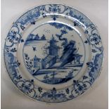 Three mid 18th century Delft blue and white dishes, variously painted with Chinese islands, the