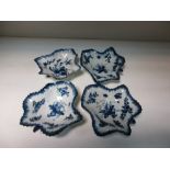 Four 18th century Bow blue and white leaf shaped pickle dishes, three painted with paired bunches of