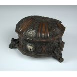 A late 17th/early 18th century Spanish American shell shaped box, two figures surmounted by an eagle