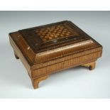 An early 19th century Japanese straw work box, the rectangular lift off lid with geometric