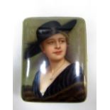 A Rosenthal porcelain cigarette case painted with a lady wearing a broad brimmed black hat and fur