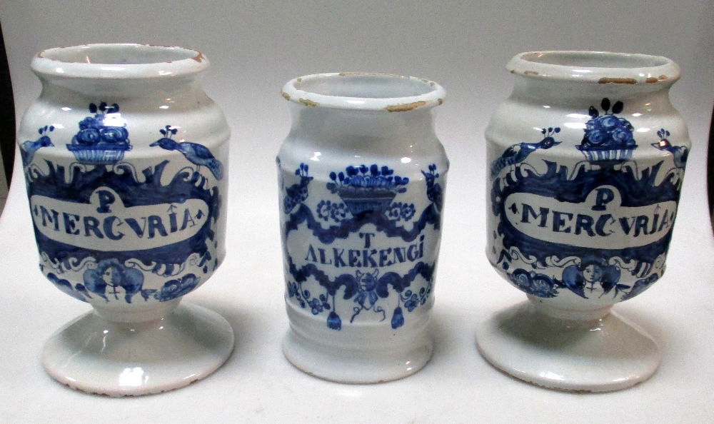 A pair and another mid 18th century Delft blue and white drug jar, the pair raised on flared - Image 8 of 10