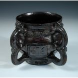 A Wrotham dark treacle glazed two handled posset pot, dated 1676, the barrel shape initialled EW and