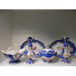 A Victorian dessert service with blue and gilt borders and floral painted centre comprising 25